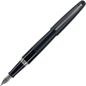 A black fountain pen with silver trim on top of it.