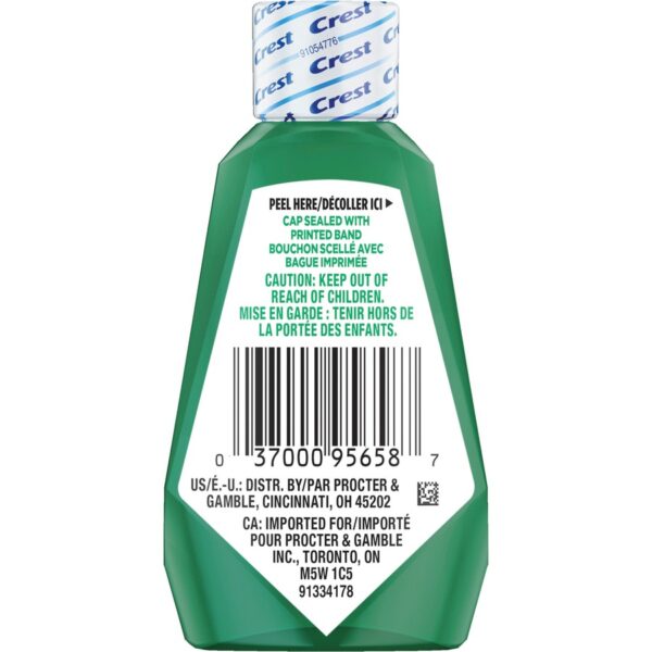 A bottle of tooth paste with the label for toothpaste.