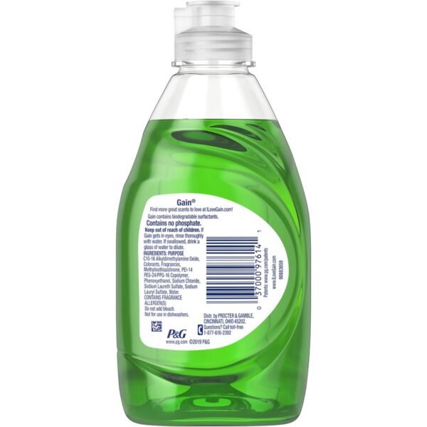 A bottle of green liquid with the label